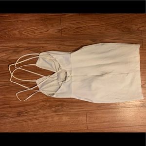H&M’s bodycon white dress with leather straps
